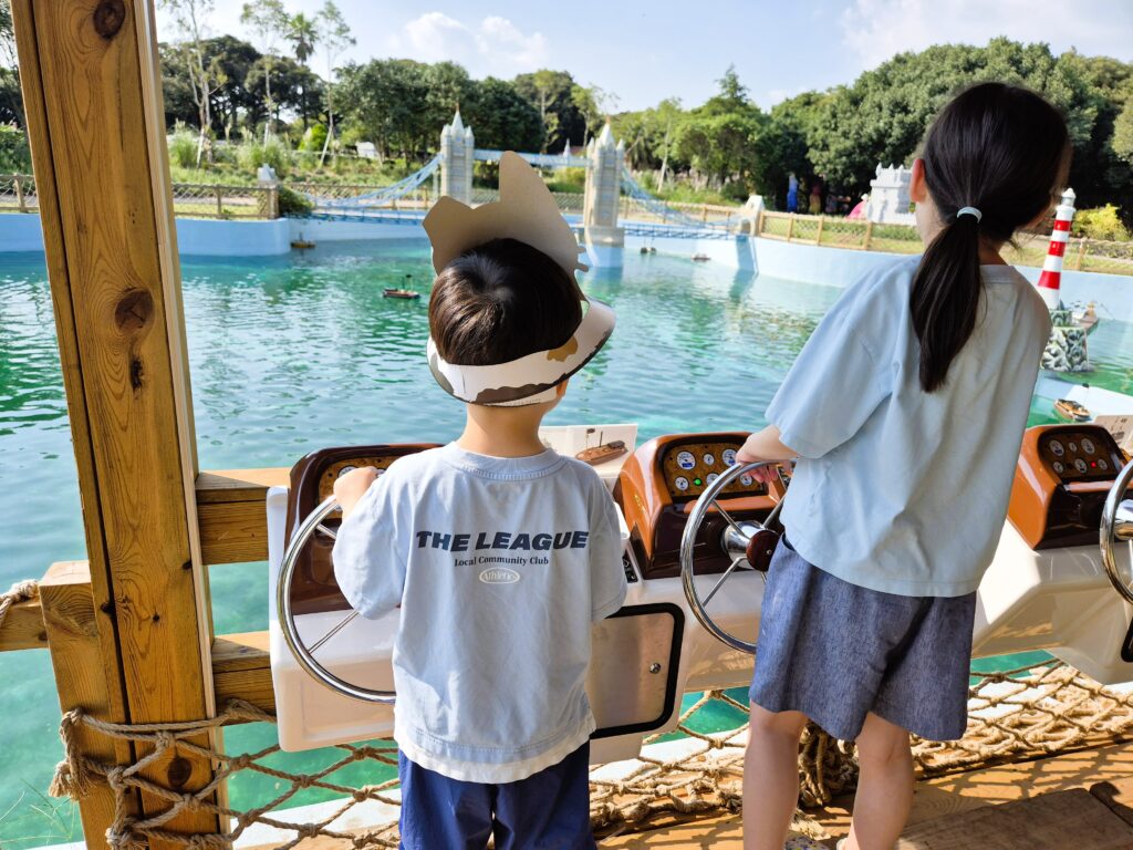 boy driving boat