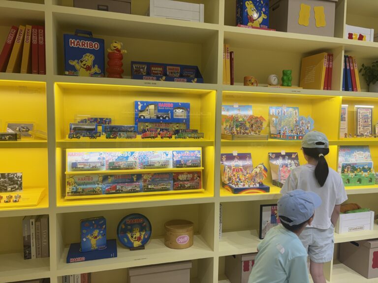 HARIBO Happy World gift shelf with racing car models and vintage tin cases