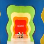 Kids posing in front of the HARIBO Happy World character